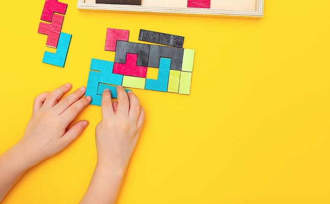 Child playing with a puzzle.