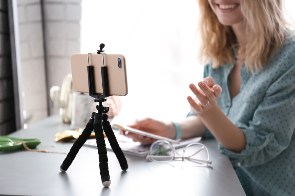 Woman recording a video.