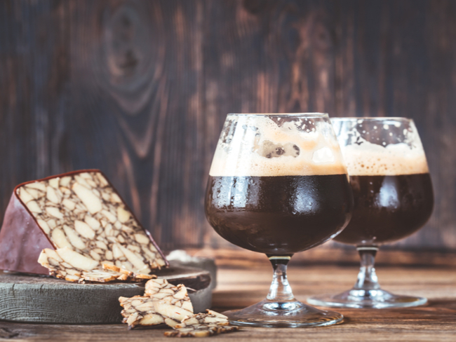 Two glasses of dark beer with Irish Porter Cheddar.