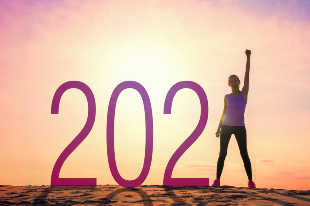 Numbers 2021 with the number 1 being a woman ready for fresh start and resolutions for accomplishing new goals.