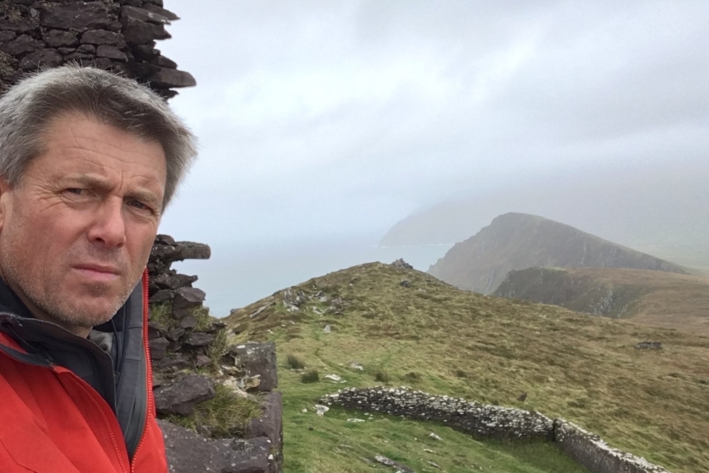 Man standing on mountain.