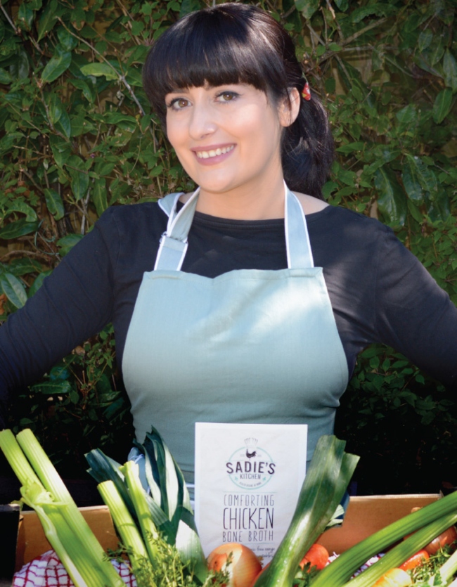 Woman in blue apron.