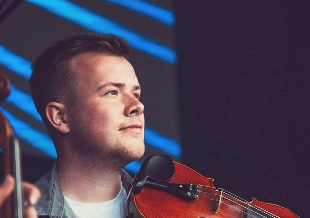 Young man playing violin.