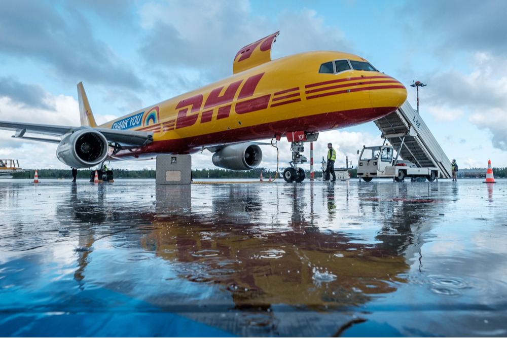 DHL jet on a runway.