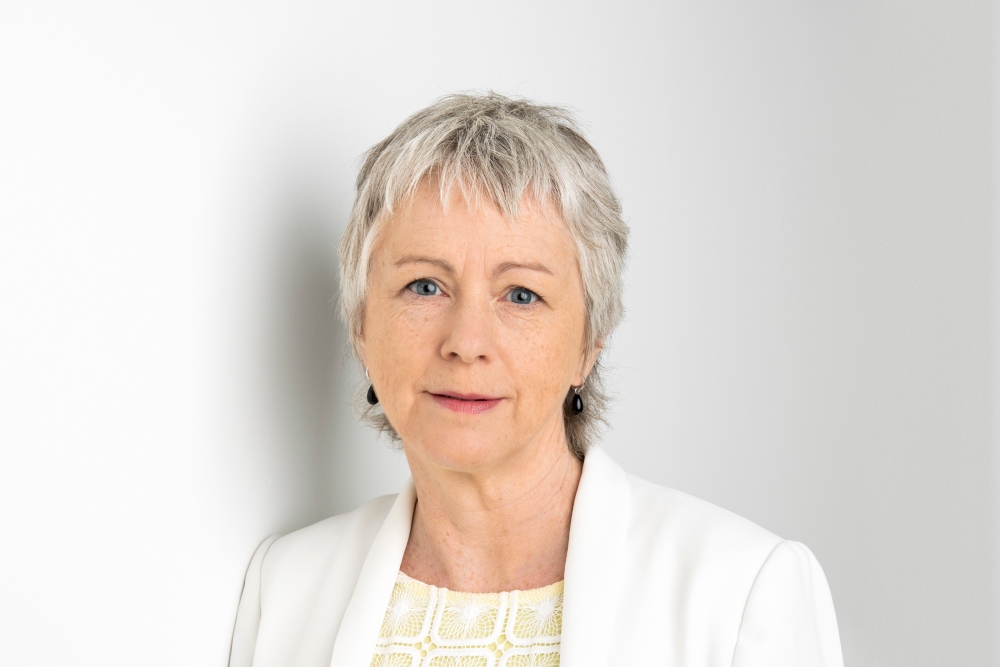 woman wearing white business suit.