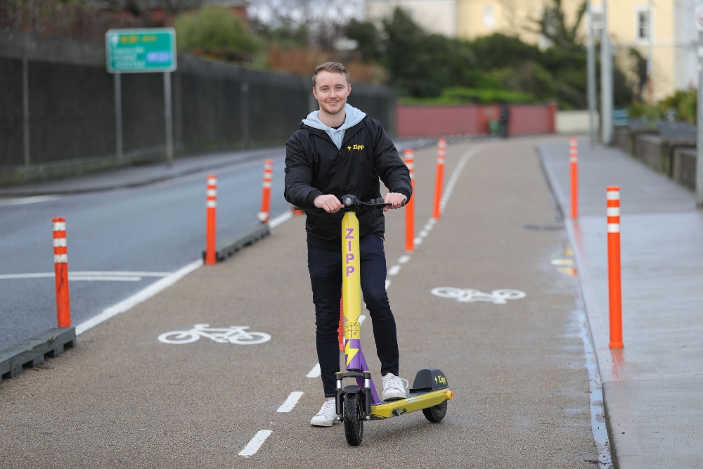 Man on a scooter.