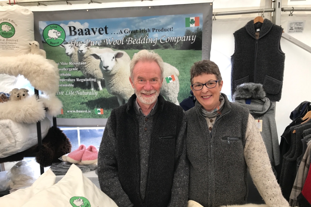 Man and woman selling woolen products.