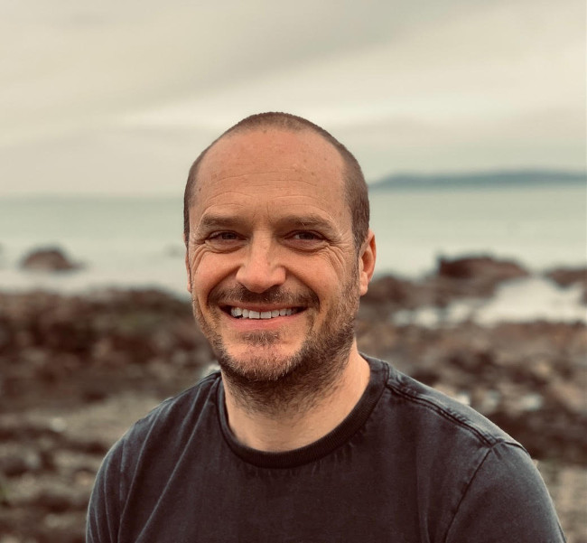 Man standing on beach.