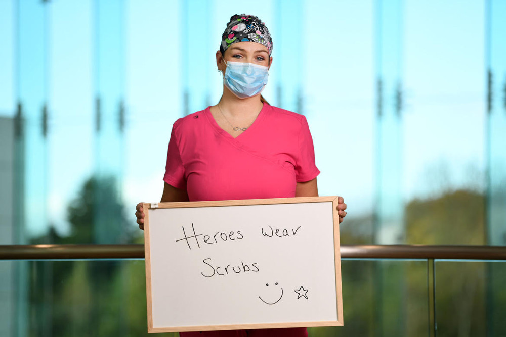 woman wearing pink scrubs.