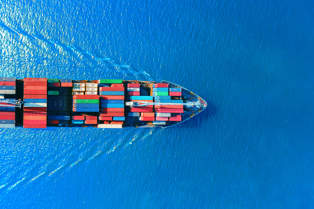 Ocean freighter crossing a blue sea.