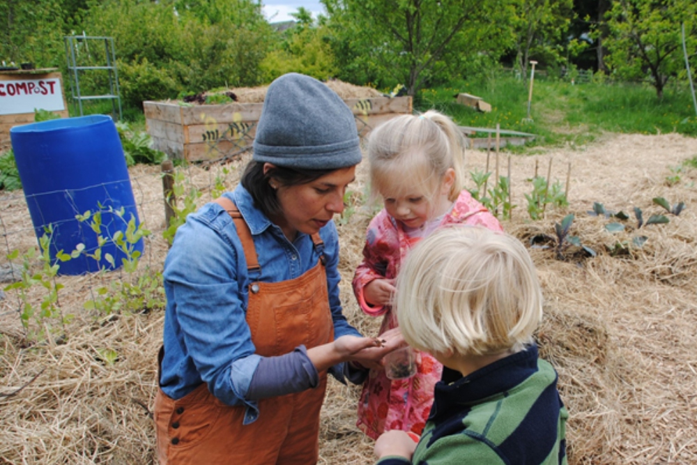 Woman teaching children about nature.