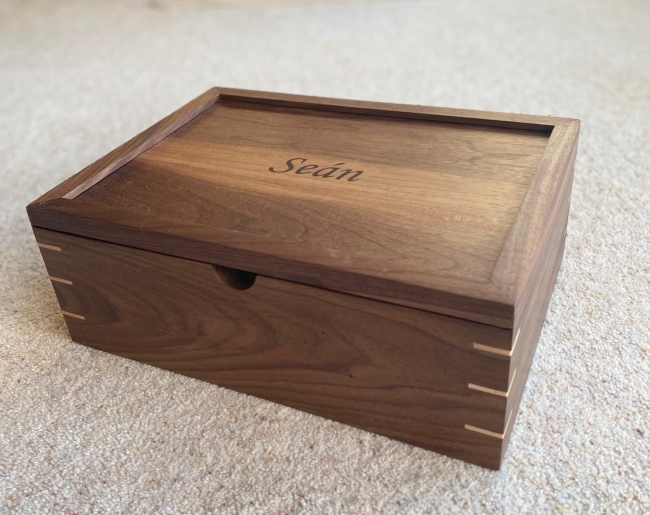 Wooden box with name Sean engraved.