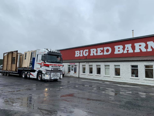 Truck outside Big Red Barn headquarters.