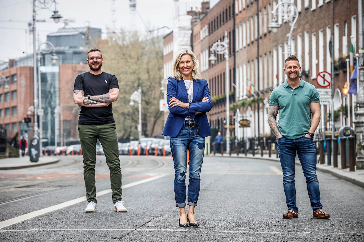 Two men and a woman on a Dublin street.