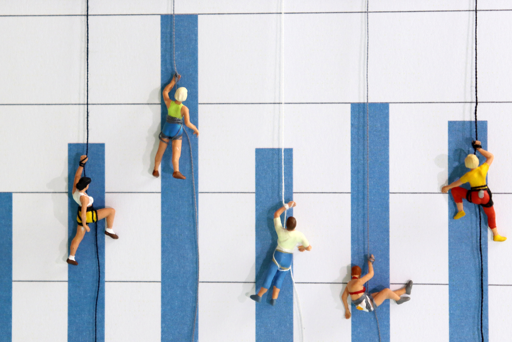 The miniature climbers use a rope to climb the blue bar graph.