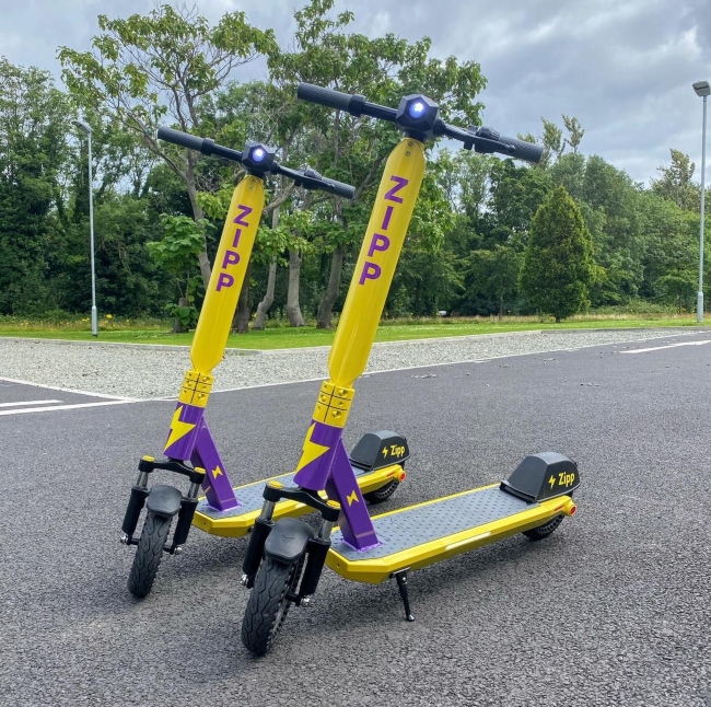 Two Zipp Mobility scooters.