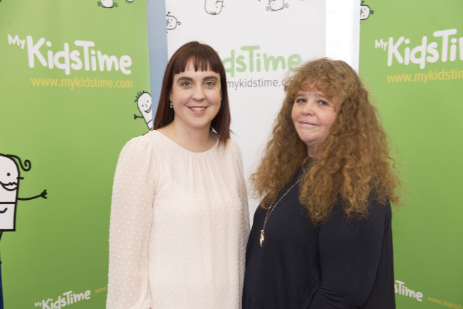 Two women smiling.