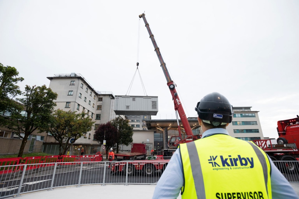 Construction engineer looking at a crane.