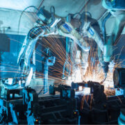 Team welding robots represent the movement. In the automotive parts industry.