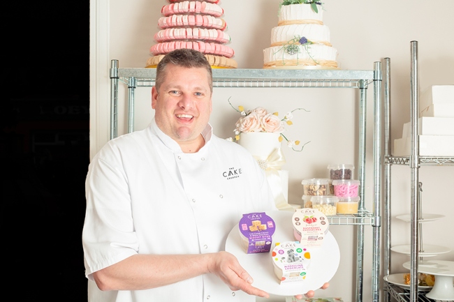 Man holding a cake.