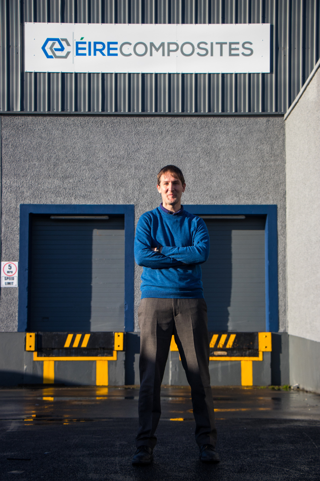 Man standing in front of an industrial unit.