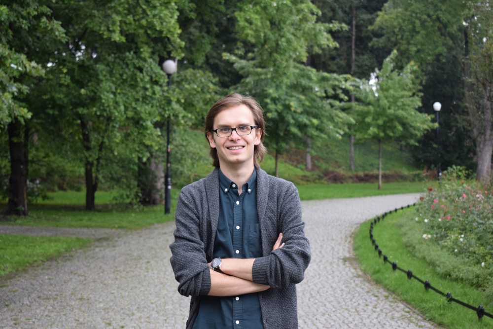 Man standing in park.