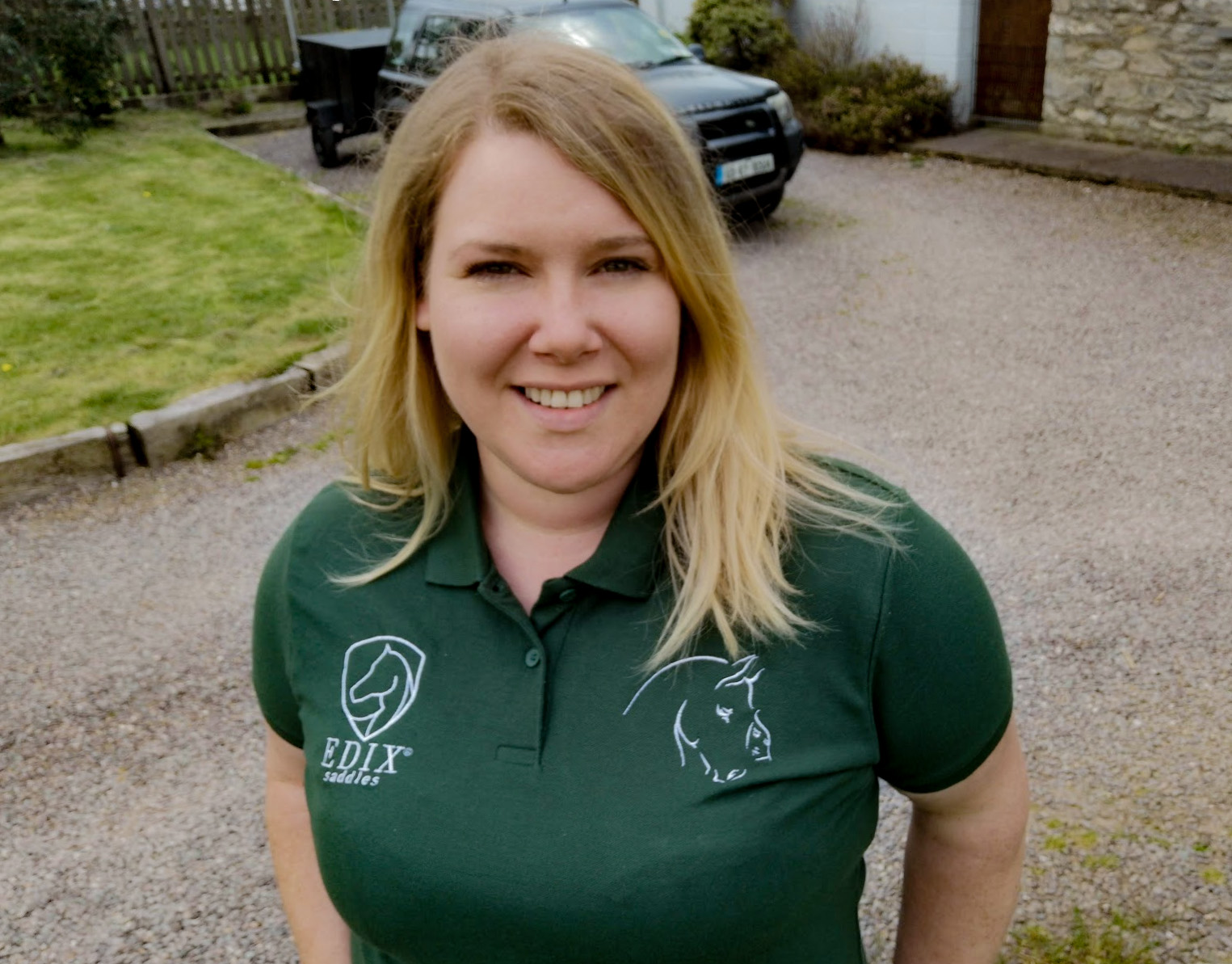 Blonde woman wearing green t-shirt.