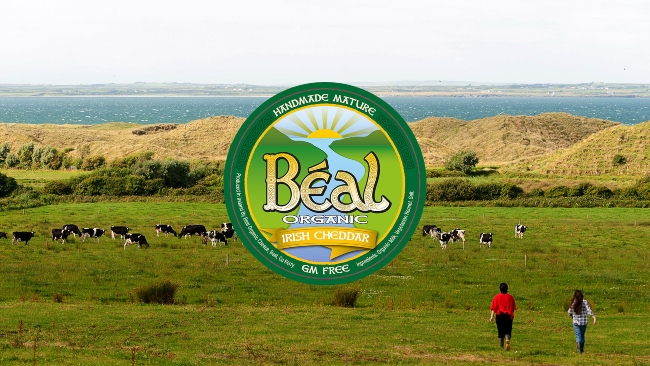 Logo for Beal Organic Cheese on a rural background.