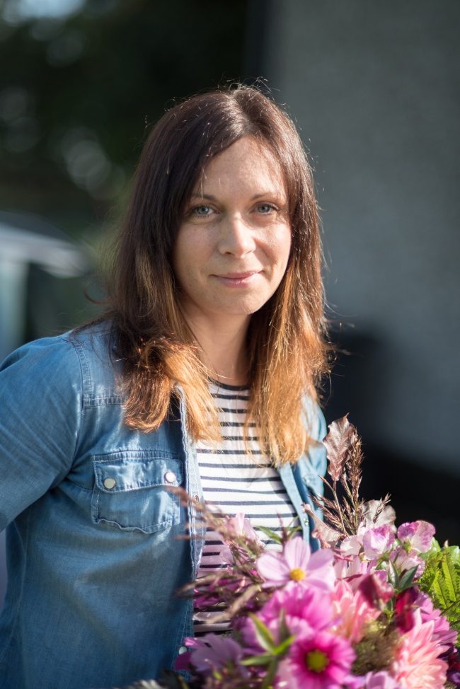 Woman working with flowers.