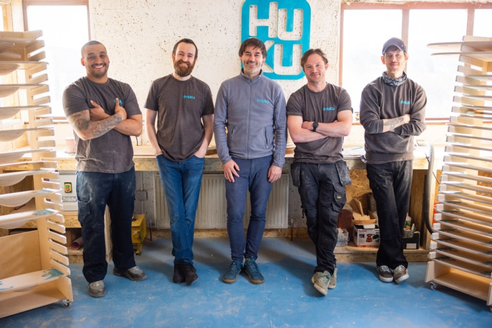 Group of men in a workshop.