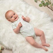 Baby wearing BambooBaby sustainable clothing.