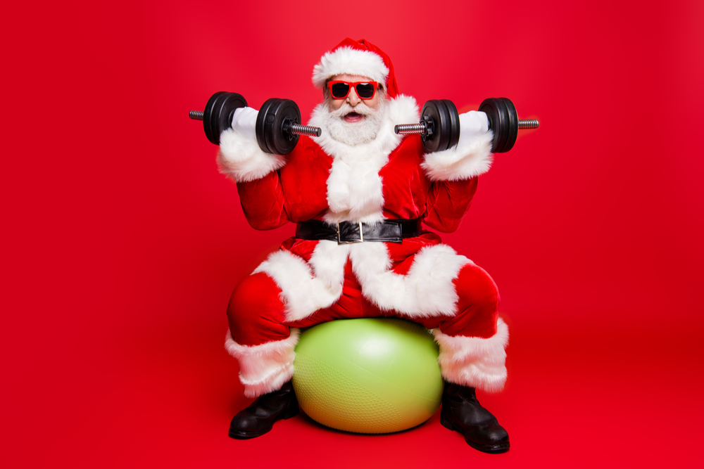 Cheerful sporty muscular virile strong Santa.