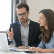 Senior businessperson mentoring a younger person.