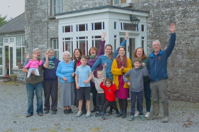 Family outside a house.