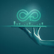 Business man showing arrow infinity symbol with neon light and dark background.