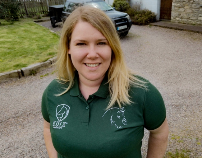 Woman wearing green t-shirt.