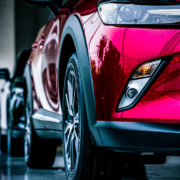 New luxury SUV compact car parked in modern showroom for sale.