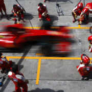 Formula One pit-stop team in action.