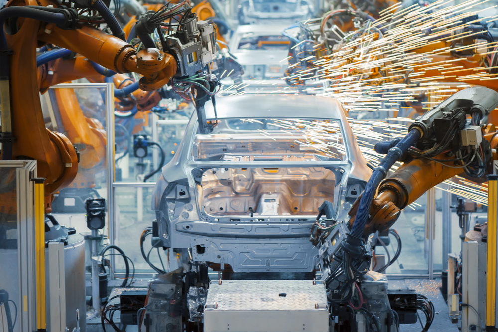 cars being manufactured on an assembly line.