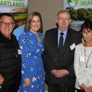 Two men and two women at an event.
