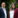 Man in navy jacket and woman in wine jacket.