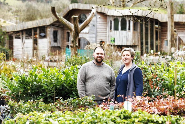 Man and woman in a garden.