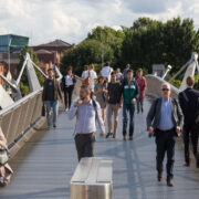 People walking on a bridge.