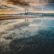 sunrise reflection viewed from Bull Island. Dublin Port at golden hour.
