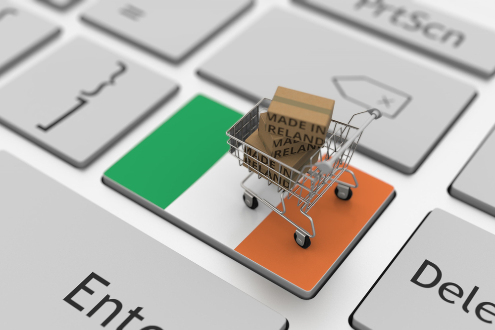 shopping trolley on Irish flag on keyboard.