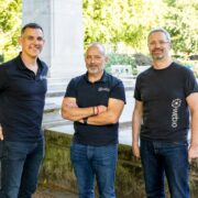 Three men in black t-shirts.