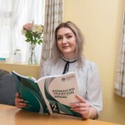 Young woman with accountancy book.