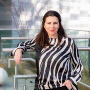Woman in black and white blouse.
