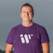 Man in purple t-shirt.