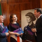 Two men and a woman talking.